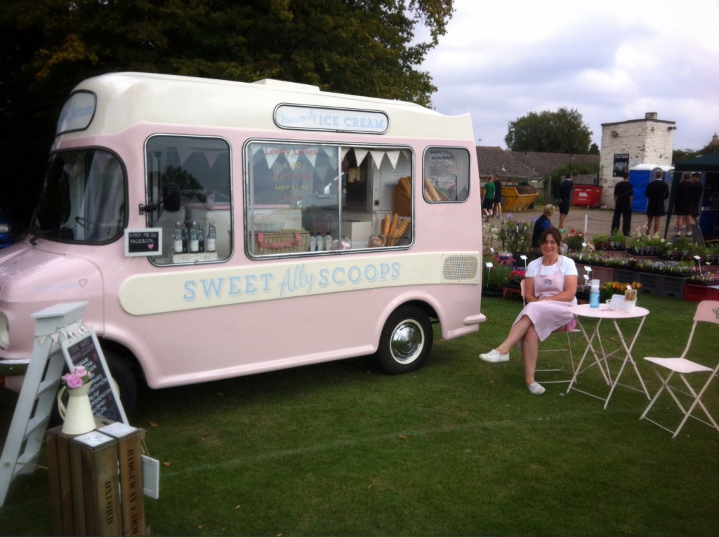 Ally sitting next to Lottie her pink ice cream van